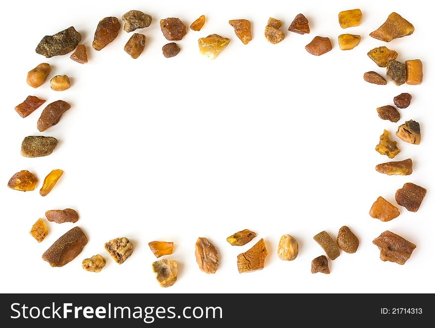 Amber frame from separated stones on white background. It is empty. Amber frame from separated stones on white background. It is empty.