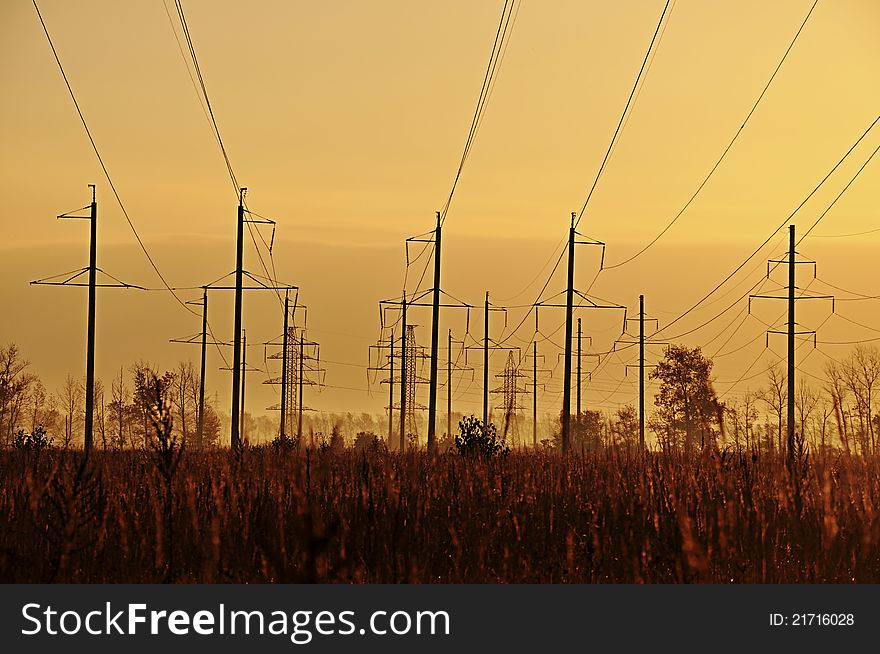 Photo of electric wires against a grass. Photo of electric wires against a grass