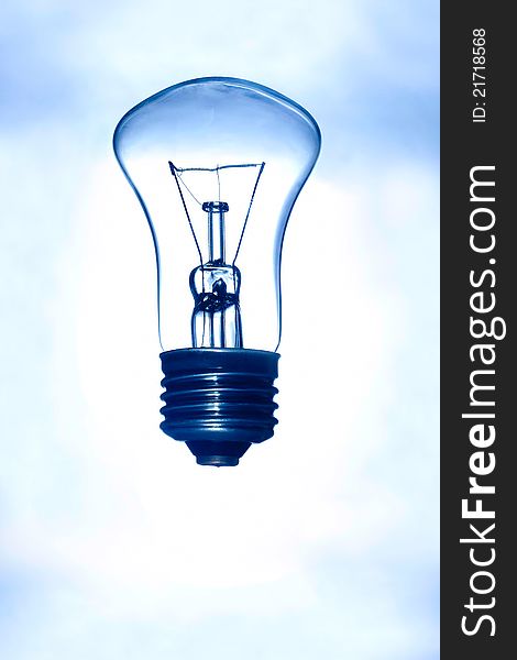 Light bulb on a blue background. Light bulb on a blue background