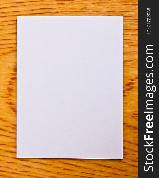 White note paper on wood table. White note paper on wood table
