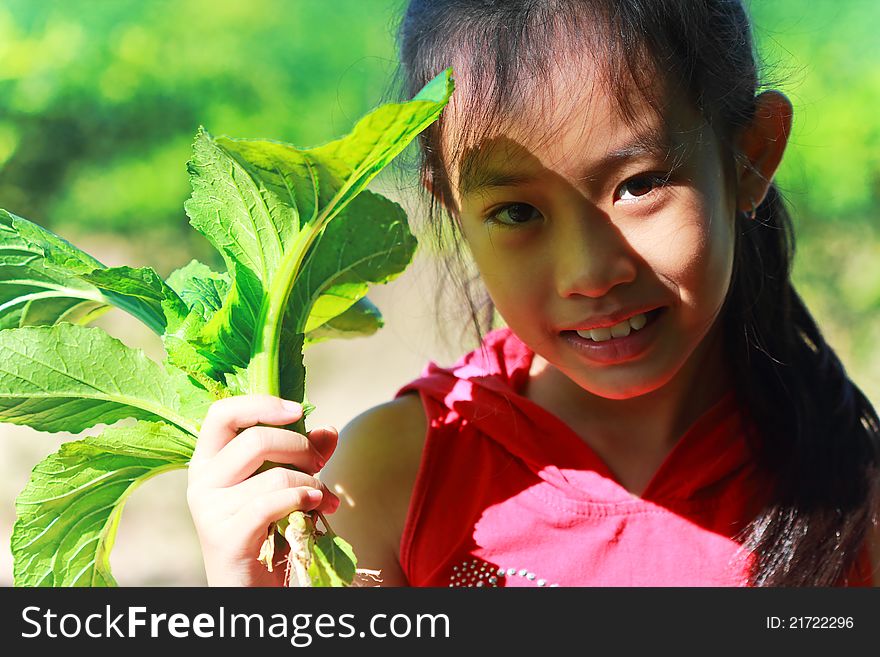 Girl Holding Organic Vegetables