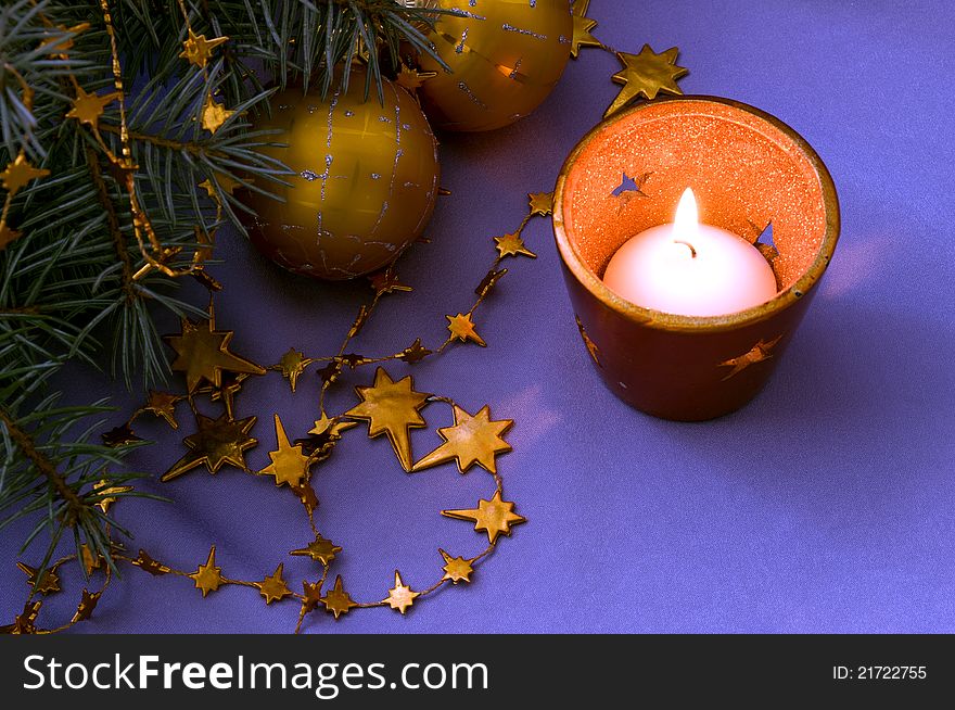 Christmas decoration with a candle and balls
