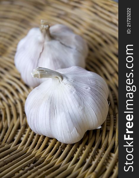 Two of organic garlics on basket