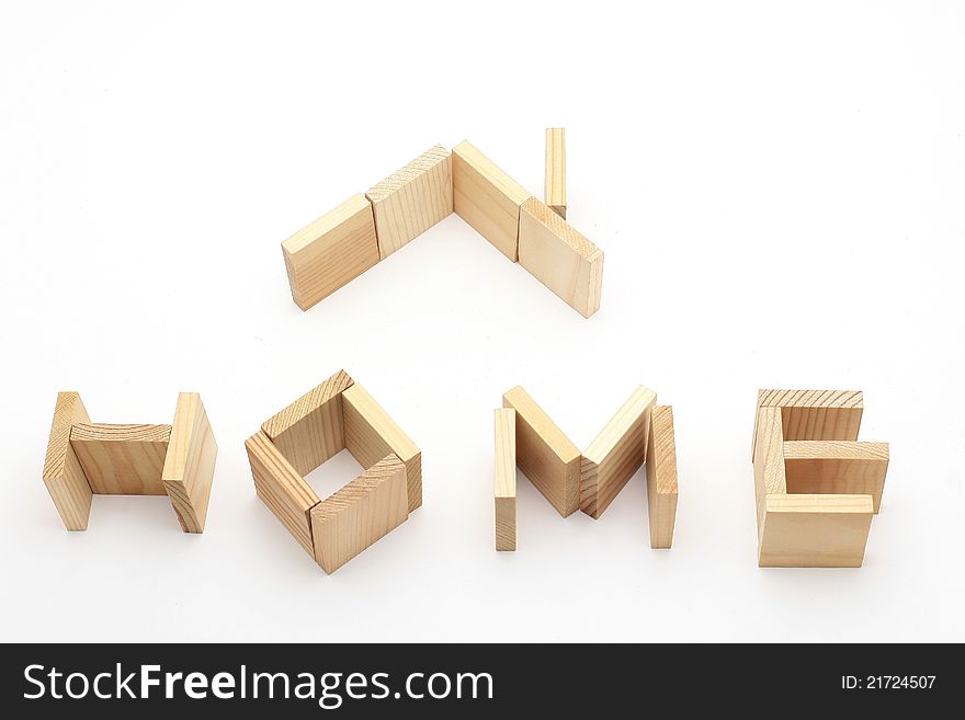 Symbol of home made from wooden bricks