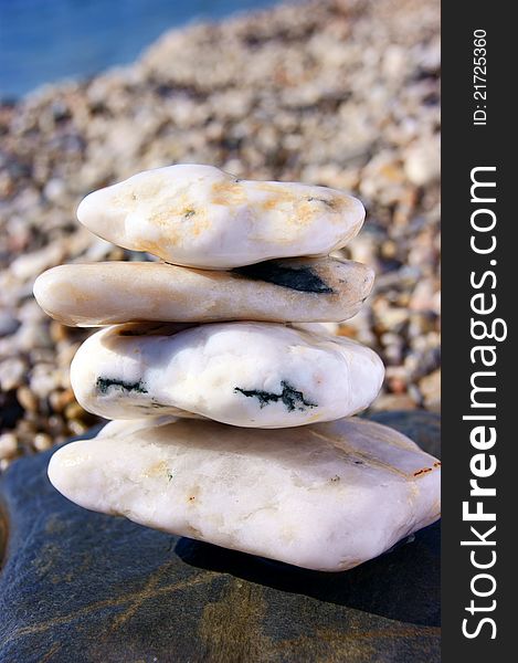 Simply white stones have been photographed on a beach, during rest