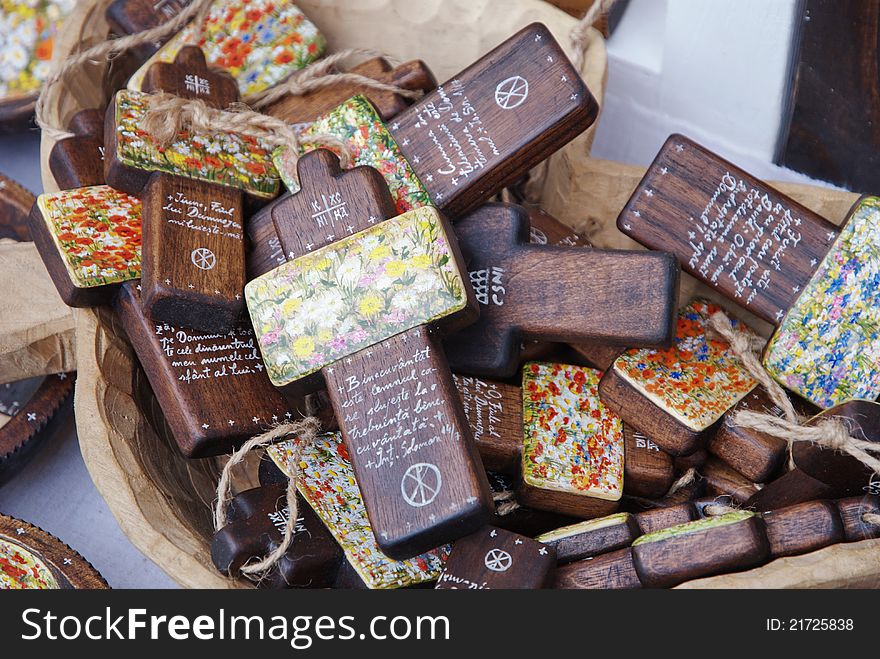 Wooden painted crossess in a basket