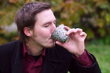 Handsome Man Drinking Tea Outdoors Royalty Free Stock Images
