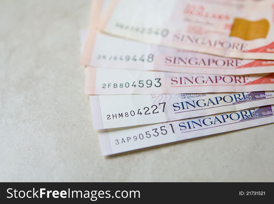 A photo of various banknotes from Singapore Indonesia. A photo of various banknotes from Singapore Indonesia