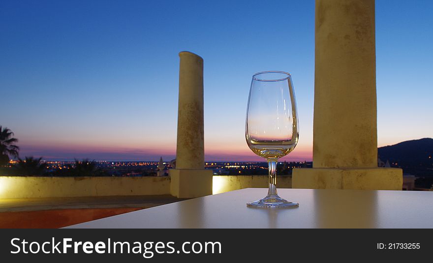 empty glass of muscat at sunset. empty glass of muscat at sunset