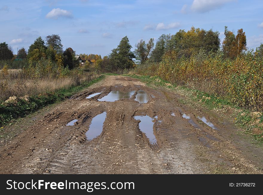 Dirty country road at village outskirts, Russia