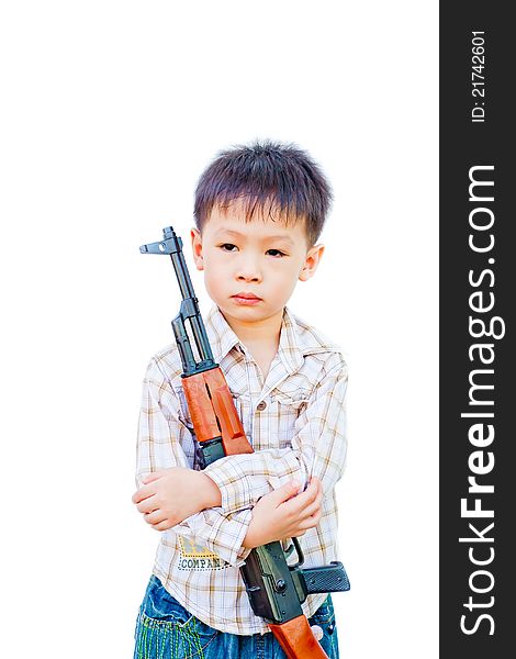 Lonely asian boy with gun in his arm