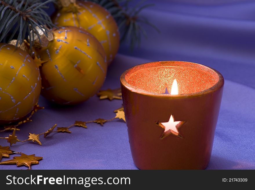 Christmas decoration with a candle and balls. Christmas decoration with a candle and balls