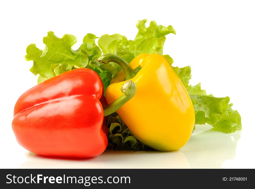Red and yellow pepper with green salad, on a white background. Red and yellow pepper with green salad, on a white background