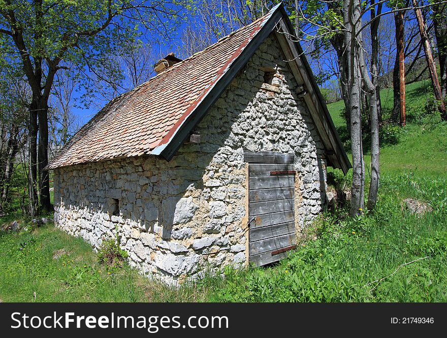 Small restored shepherd farmhouse in natural park by a sunny day. Small restored shepherd farmhouse in natural park by a sunny day