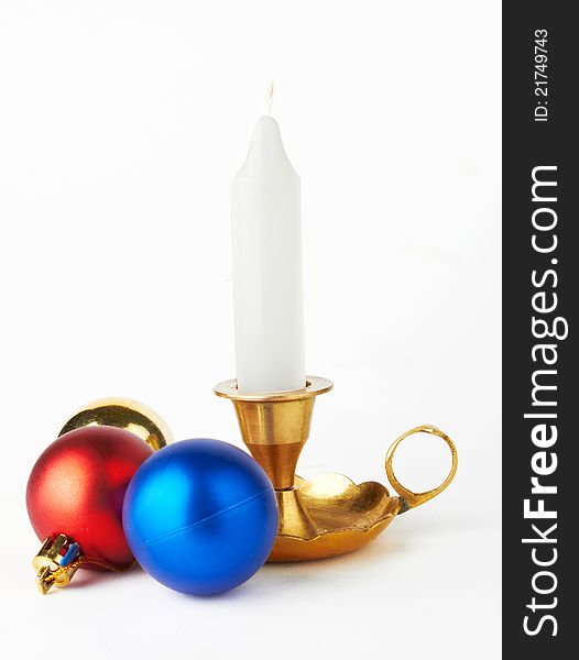 Christmas and New Year decoration- balls and candle .On white background