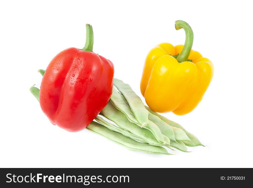 Green beans with yellow and red peppers on a white background