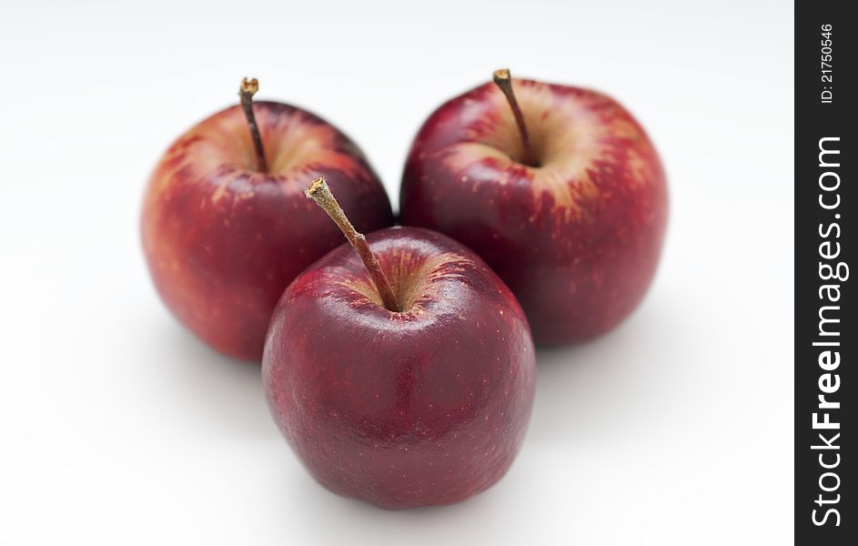 Three red heirloom apples with white background. Three red heirloom apples with white background