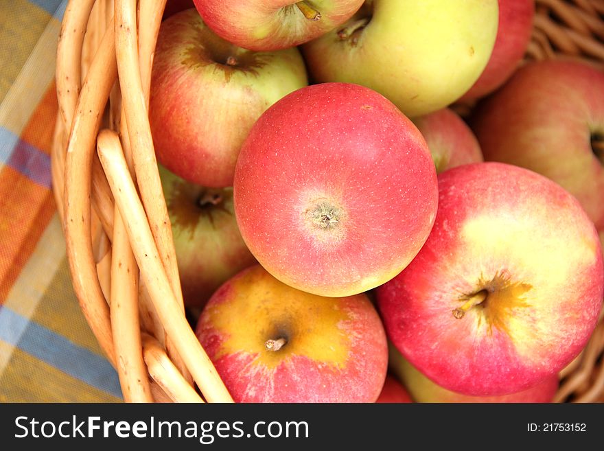 Beautiful red apples in a basket