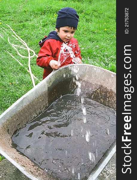 Boy playing with water