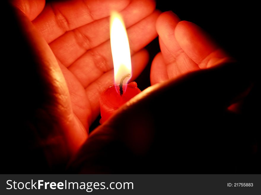 Candle in the hands of women. Candle in the hands of women