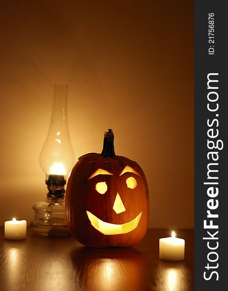 Halloween carved pumpkin with oil lamp and candles. Halloween carved pumpkin with oil lamp and candles