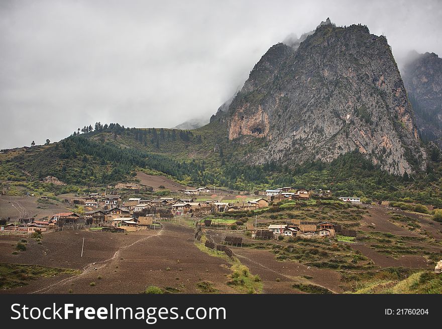 Mountain and village in cloud day