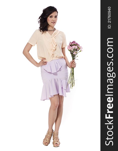 Woman holding flower in white background with purple dress. Woman holding flower in white background with purple dress.