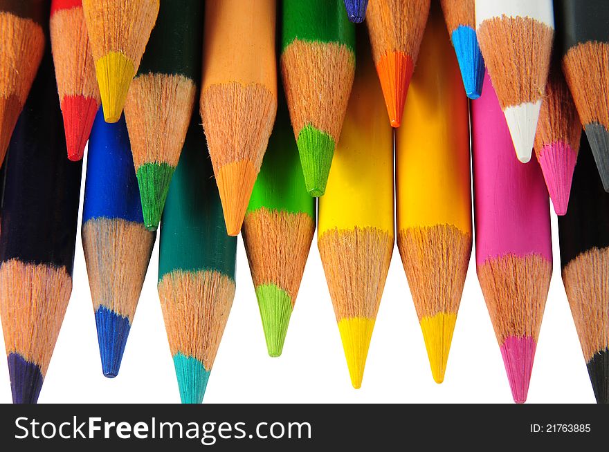 Arranged color pencils over white. Arranged color pencils over white.