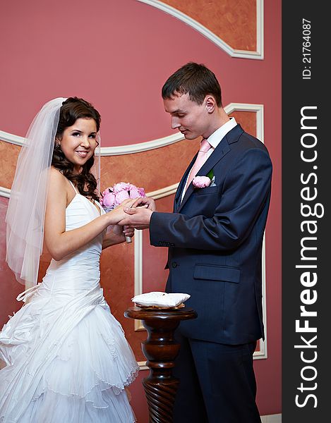 Elegant Groom Wears A Wedding Ring A Happy Bride