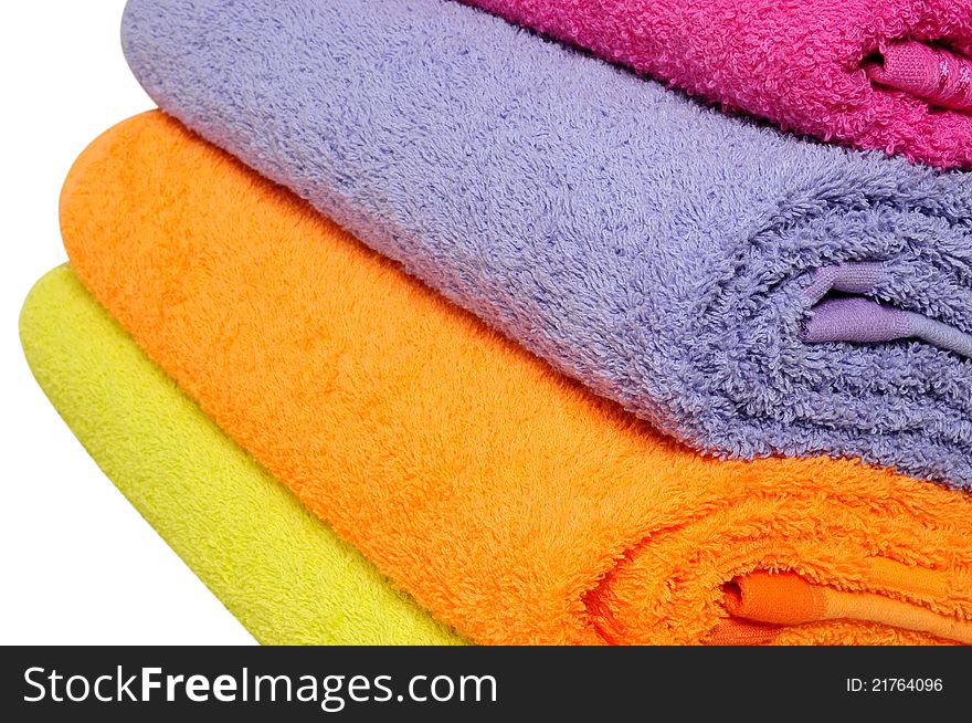 Folded bath towels over white background. Folded bath towels over white background.