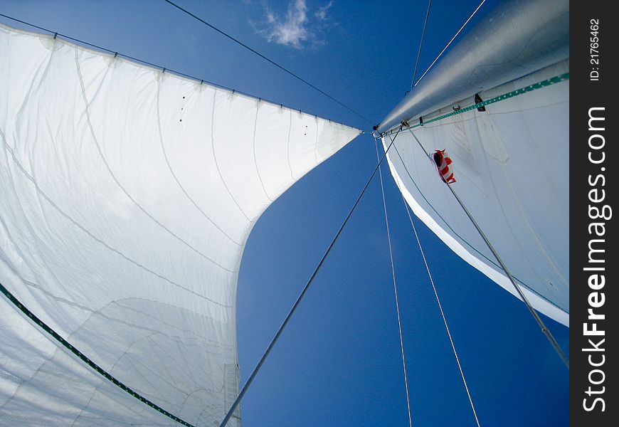 View of sails on the blue sky.