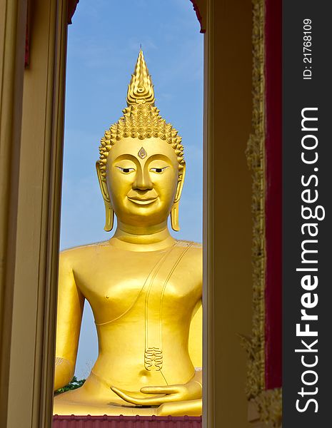 Large golden Buddha. In a temple in Thailand.