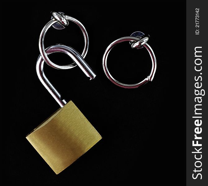 Opened padlock on black background