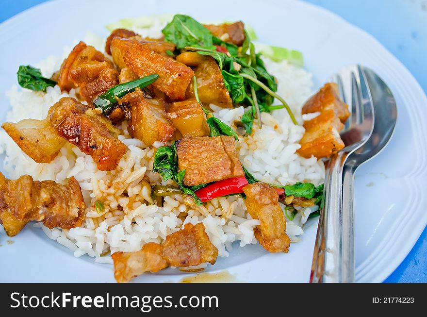 Spicy Crispy Pork with Thai Basil Sauce on rice