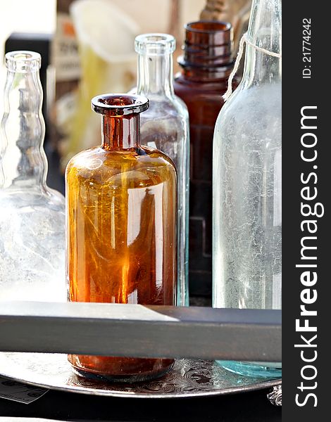 Assortment of clear and brown glass bottles. Assortment of clear and brown glass bottles