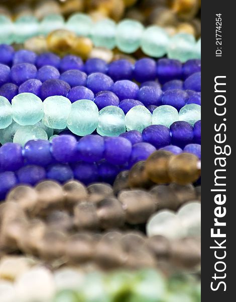 Glass beads in various shades of blue and brown. Glass beads in various shades of blue and brown