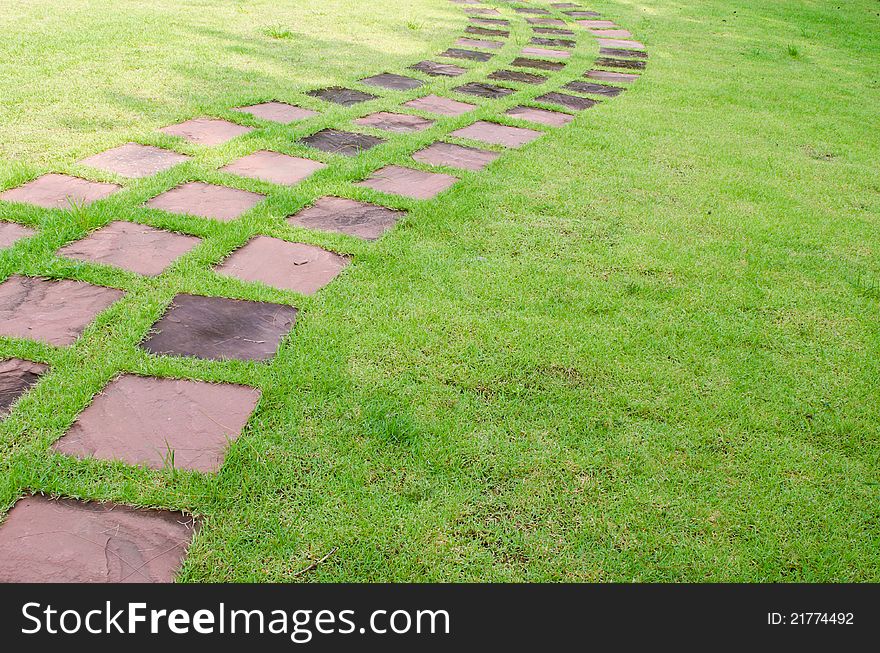 Stone walkway line on grass in the garden. Stone walkway line on grass in the garden
