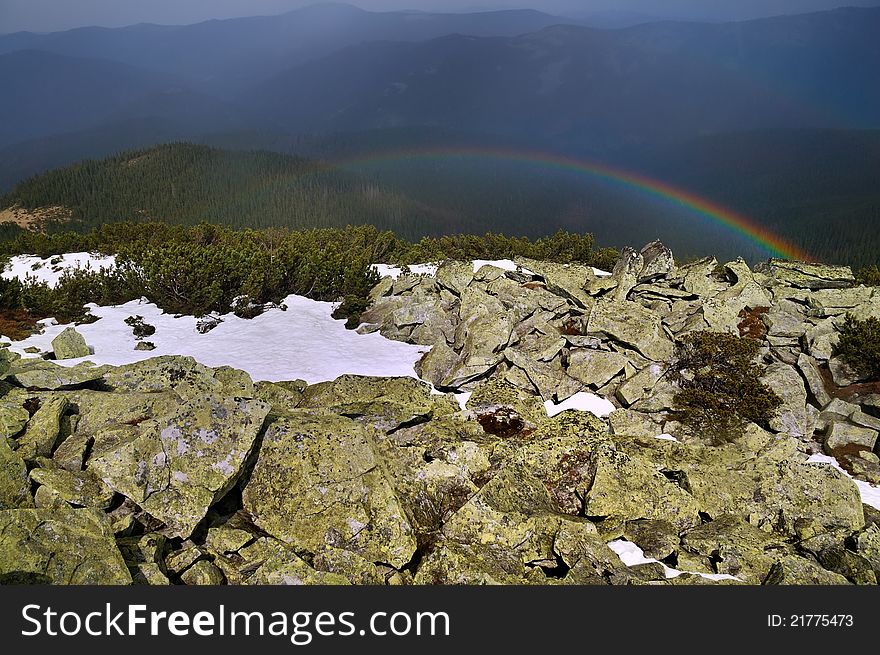 Multi-colored rainbow high in the mountains. Multi-colored rainbow high in the mountains