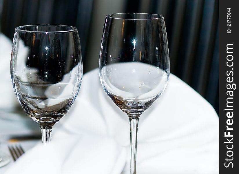 Elegant wine glasses are in a restaurant