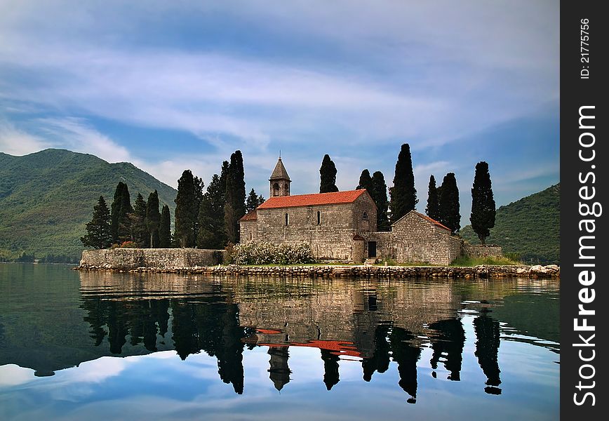 An ancient castle on a mountain lake. An ancient castle on a mountain lake