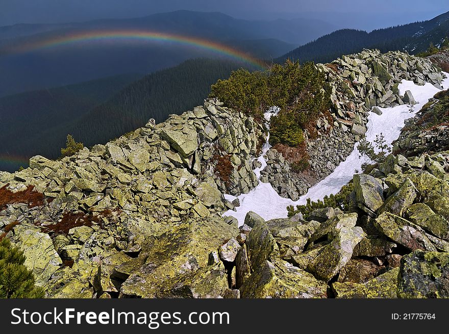 Rainbow high in the mountains after the rain