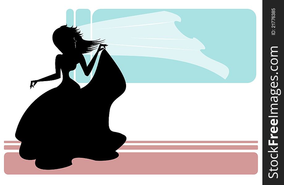 A bride's silhouette as the wind gracefully dances with her veil. A bride's silhouette as the wind gracefully dances with her veil
