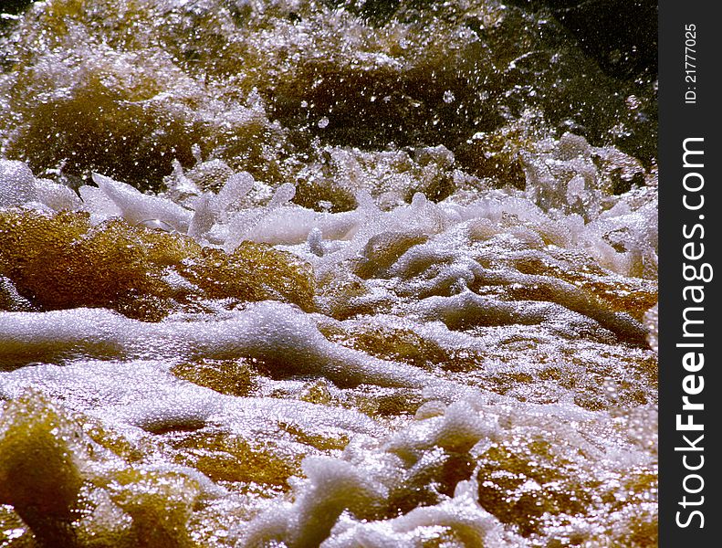 Surface of river with foam and splash like as beer