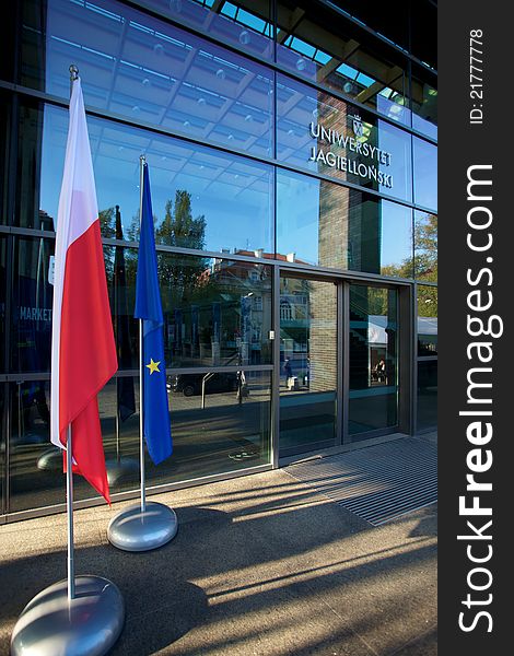 Europe and Polish Flags floating in a European conference about the global market in Poland with windows in the background