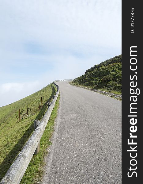 Empty road near of  the lakes of Covadonga, National Park Picos de Europa, Asturias, Spain
