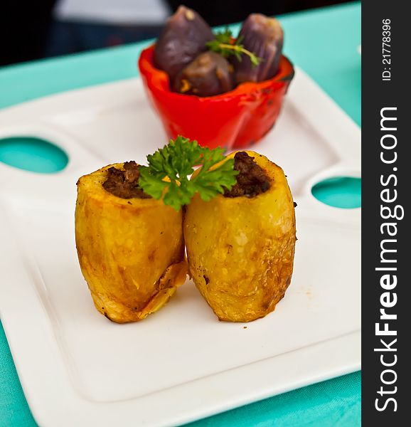 Stuffed potatoes and grilled aubergines with pepper.