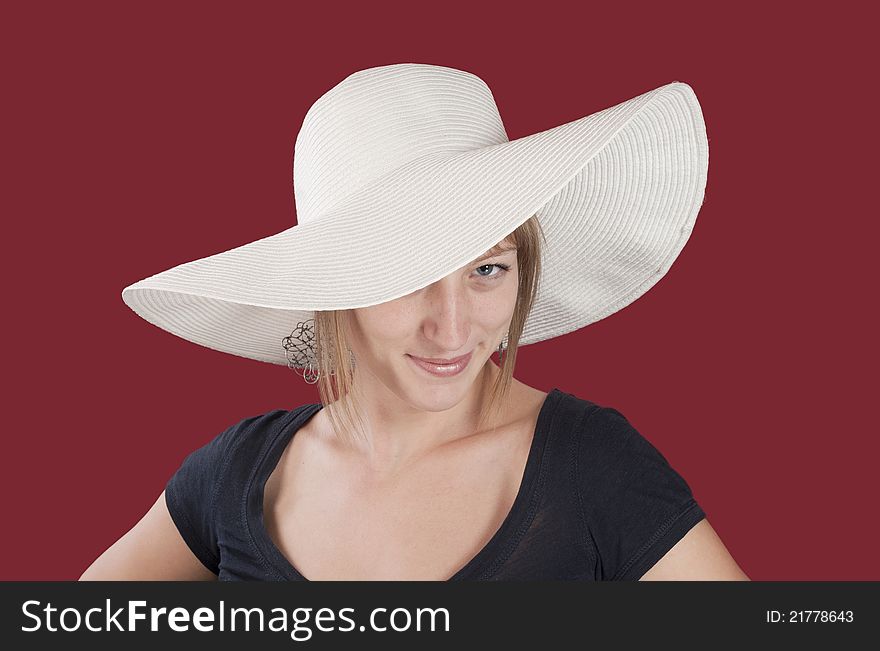 Young lady with white hat agains red