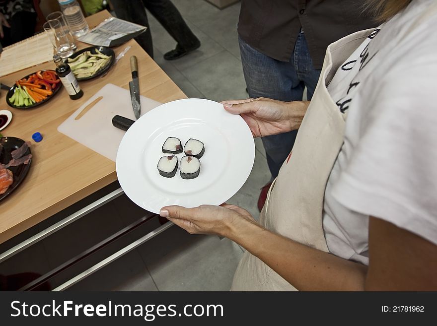Fresh sushi served on white plate.