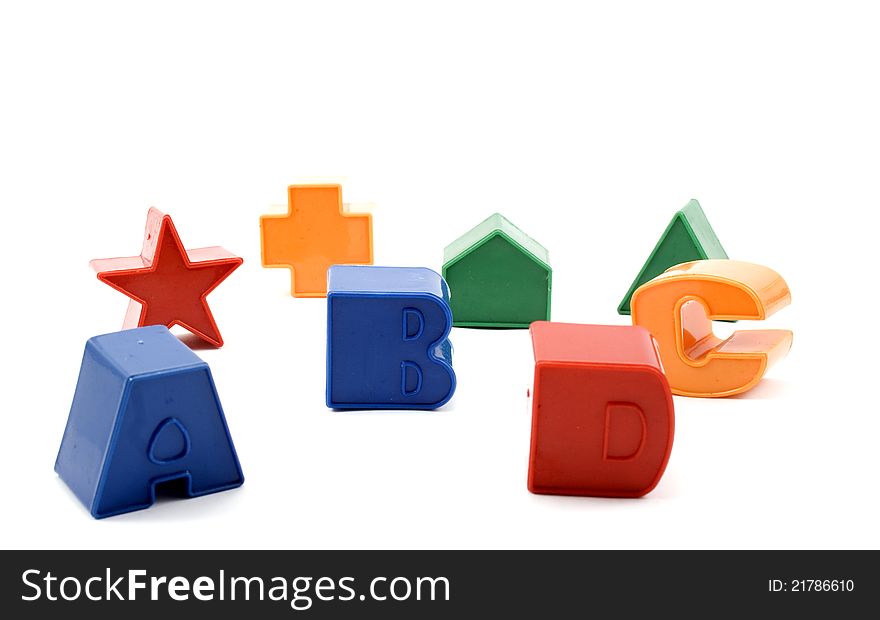 Toy figures and letters isolated on white background