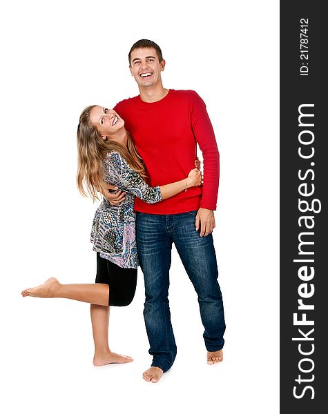 Loving couple embracing in studio on white background